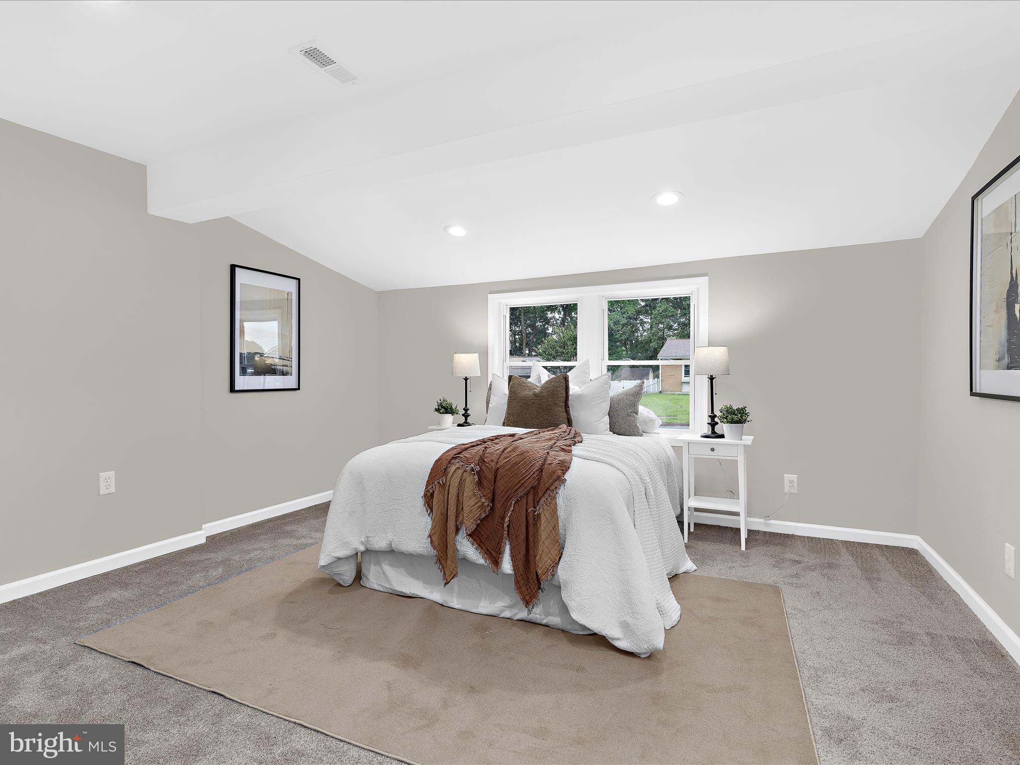 813 Ferguson Road Joppa, MD 21085 - Photo 27 of 39 a spacious bedroom with a bed and a large mirror