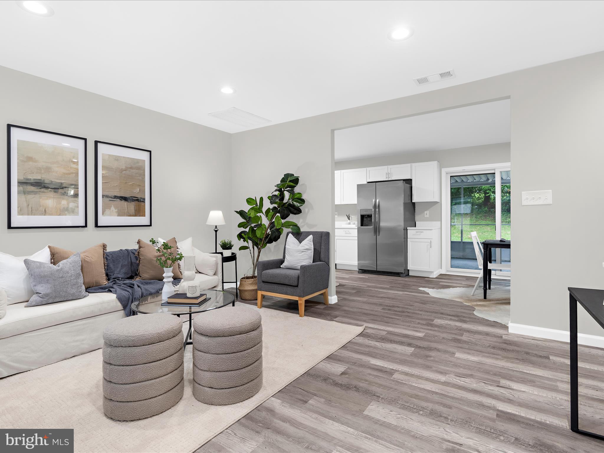 813 Ferguson Road Joppa, MD 21085 - Photo 7 of 39 a living room with furniture and a large window