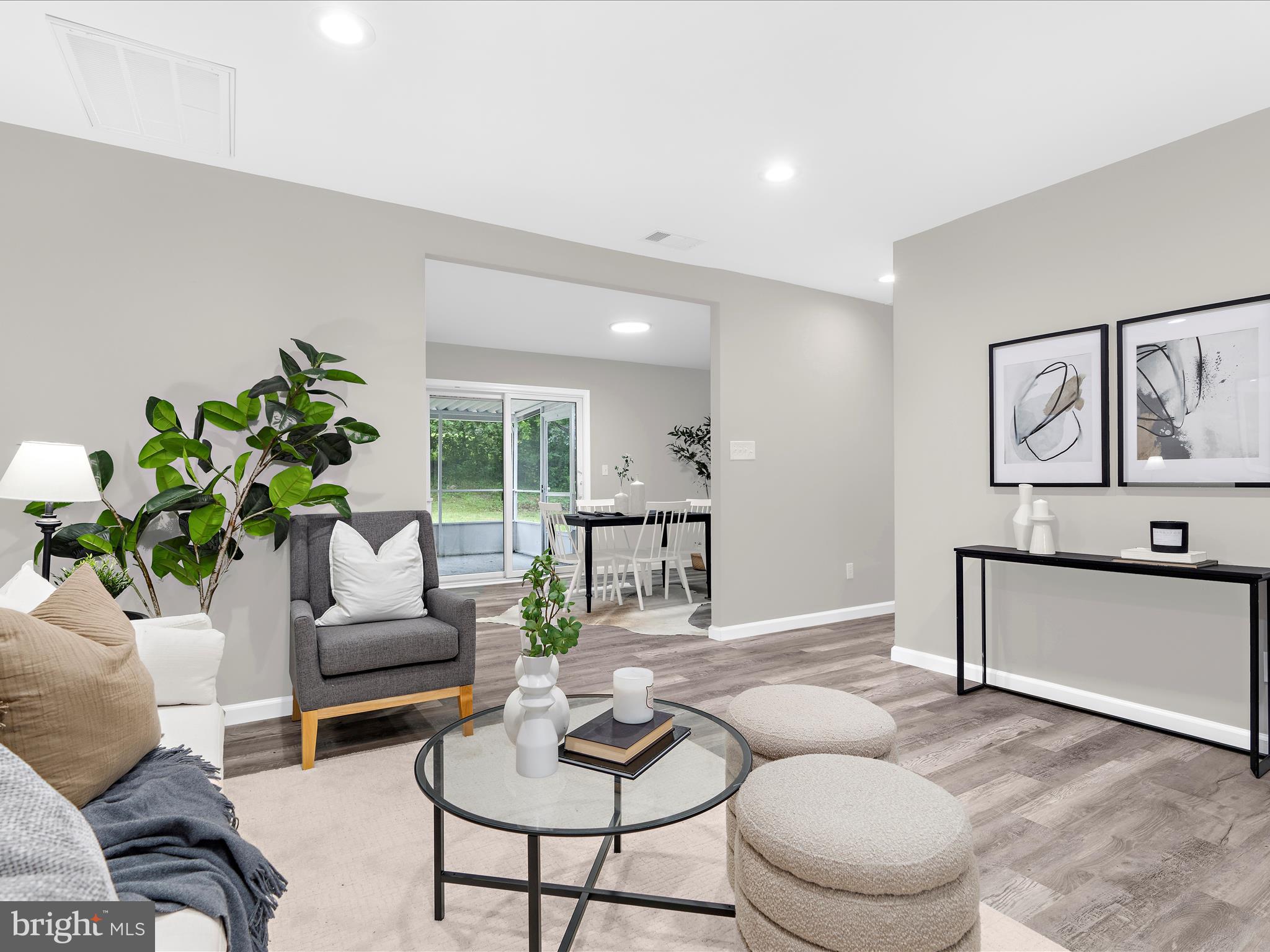 813 Ferguson Road Joppa, MD 21085 - Photo 10 of 39 a living room with furniture and a potted plant