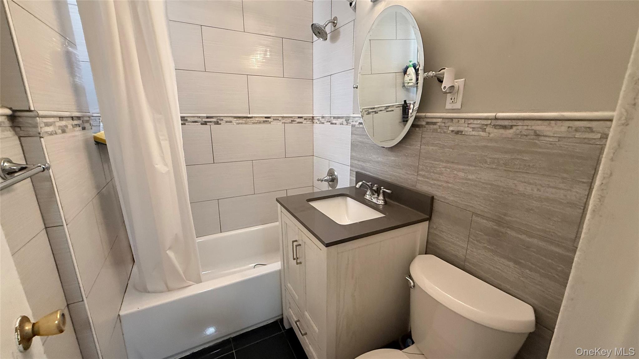 112-25 34th Avenue, Unit G Queens, NY 11368 - Photo 23 of 47 a bathroom with a sink toilet and shower