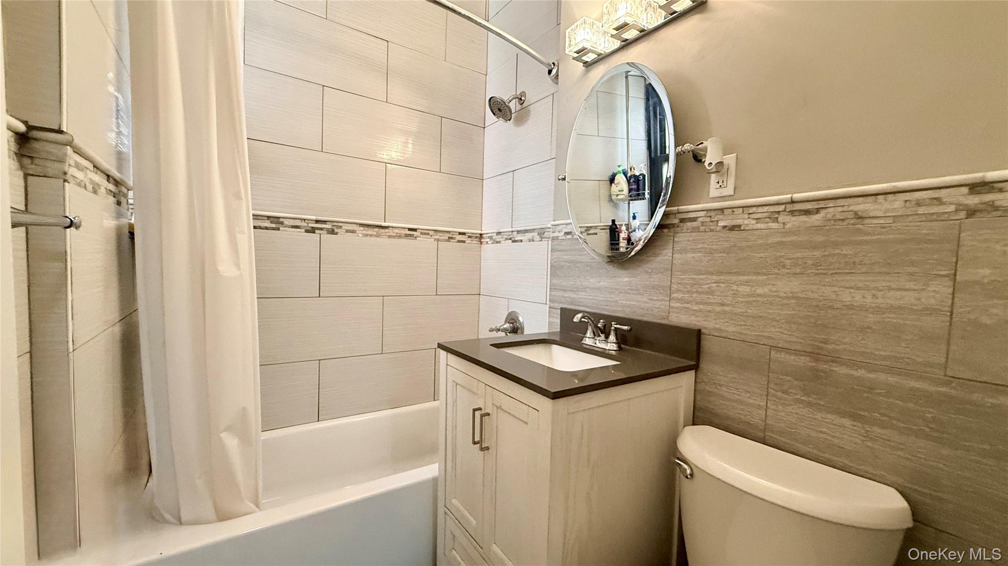 112-25 34th Avenue, Unit G Queens, NY 11368 - Photo 25 of 47 a bathroom with a sink a toilet and shower