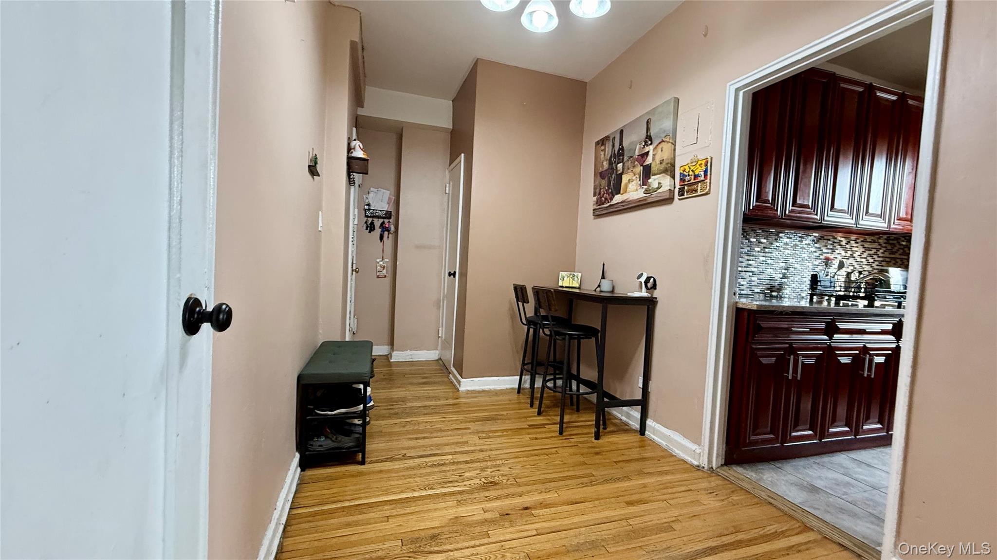 112-25 34th Avenue, Unit G Queens, NY 11368 - Photo 5 of 47 a view of a livingroom with furniture and front door