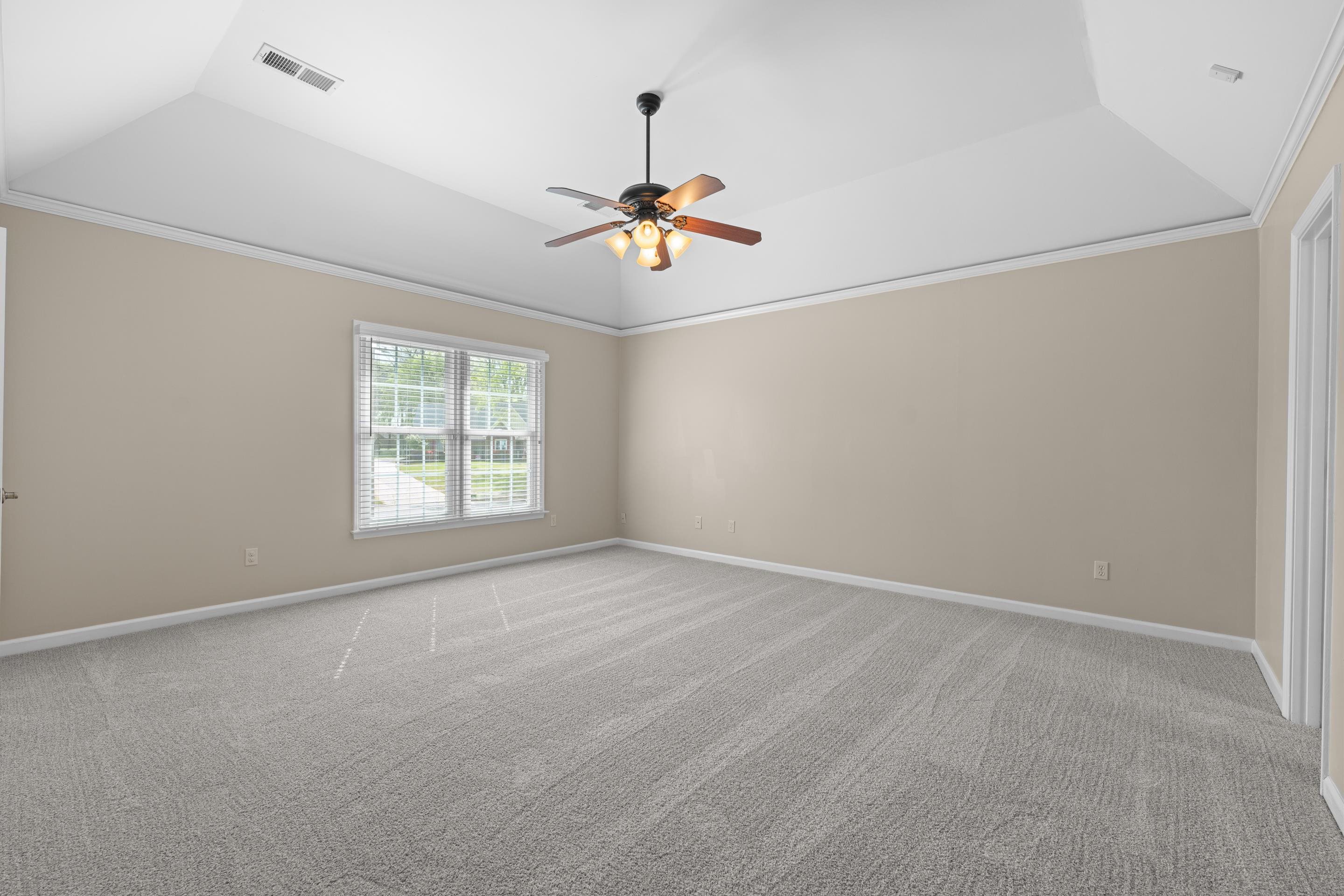 677 Gunnison Cove Collierville, TN 38017 - Photo 12 of 30 an empty room with windows and fan