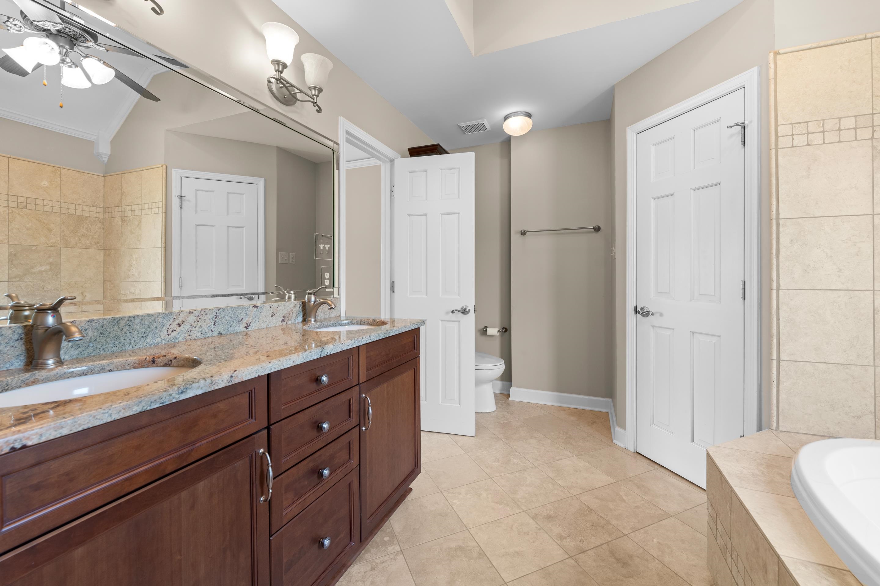 677 Gunnison Cove Collierville, TN 38017 - Photo 15 of 30 a spacious bathroom with a double vanity sink mirror and double