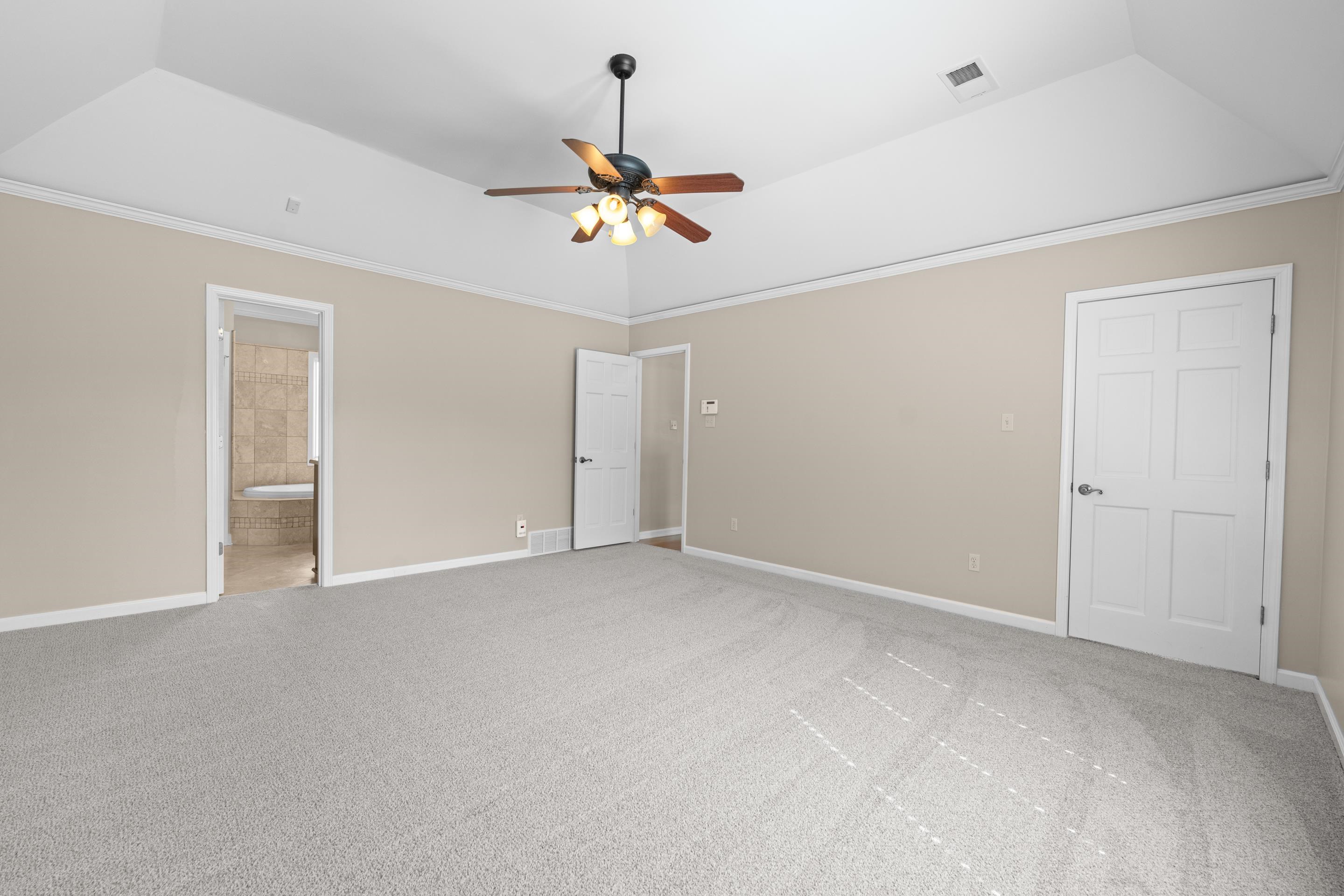 677 Gunnison Cove Collierville, TN 38017 - Photo 16 of 30 a view of an empty room with a ceiling fan