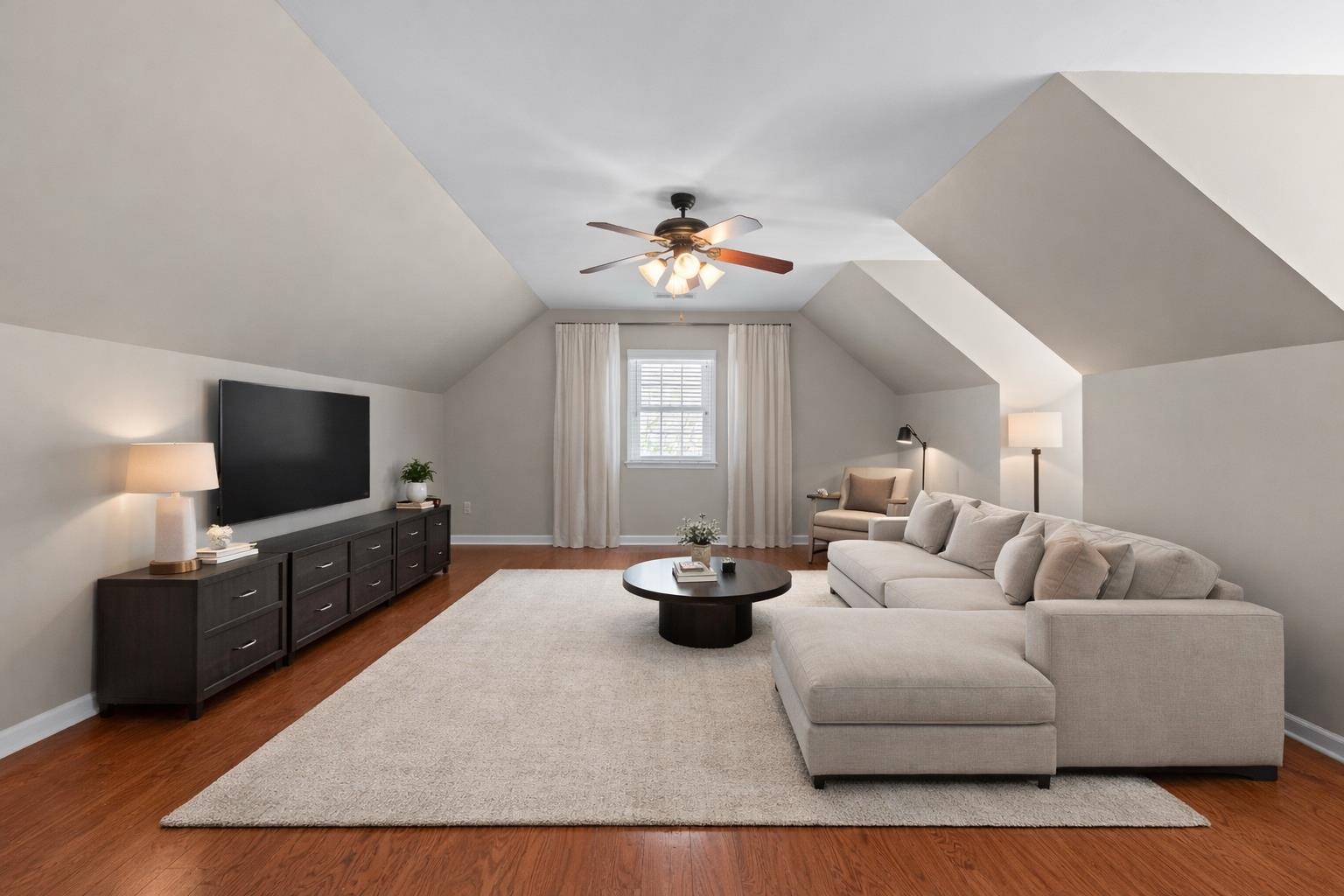 677 Gunnison Cove Collierville, TN 38017 - Photo 20 of 30 a living room with furniture and a flat screen tv
