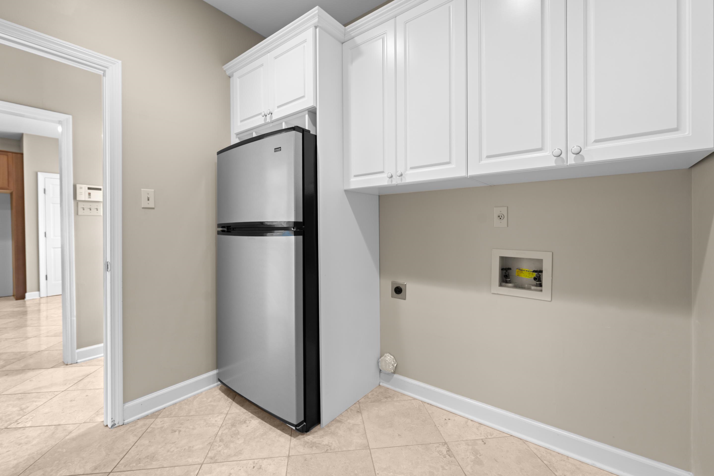 677 Gunnison Cove Collierville, TN 38017 - Photo 23 of 30 a white refrigerator freezer and a granite floor