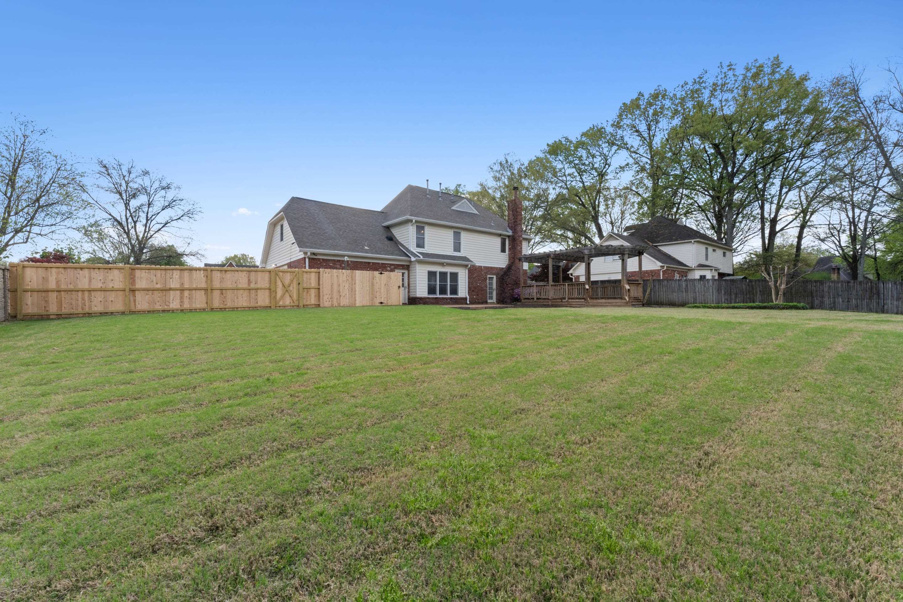 677 Gunnison Cove Collierville, TN 38017 - Photo 24 of 30 a view of a house with a yard