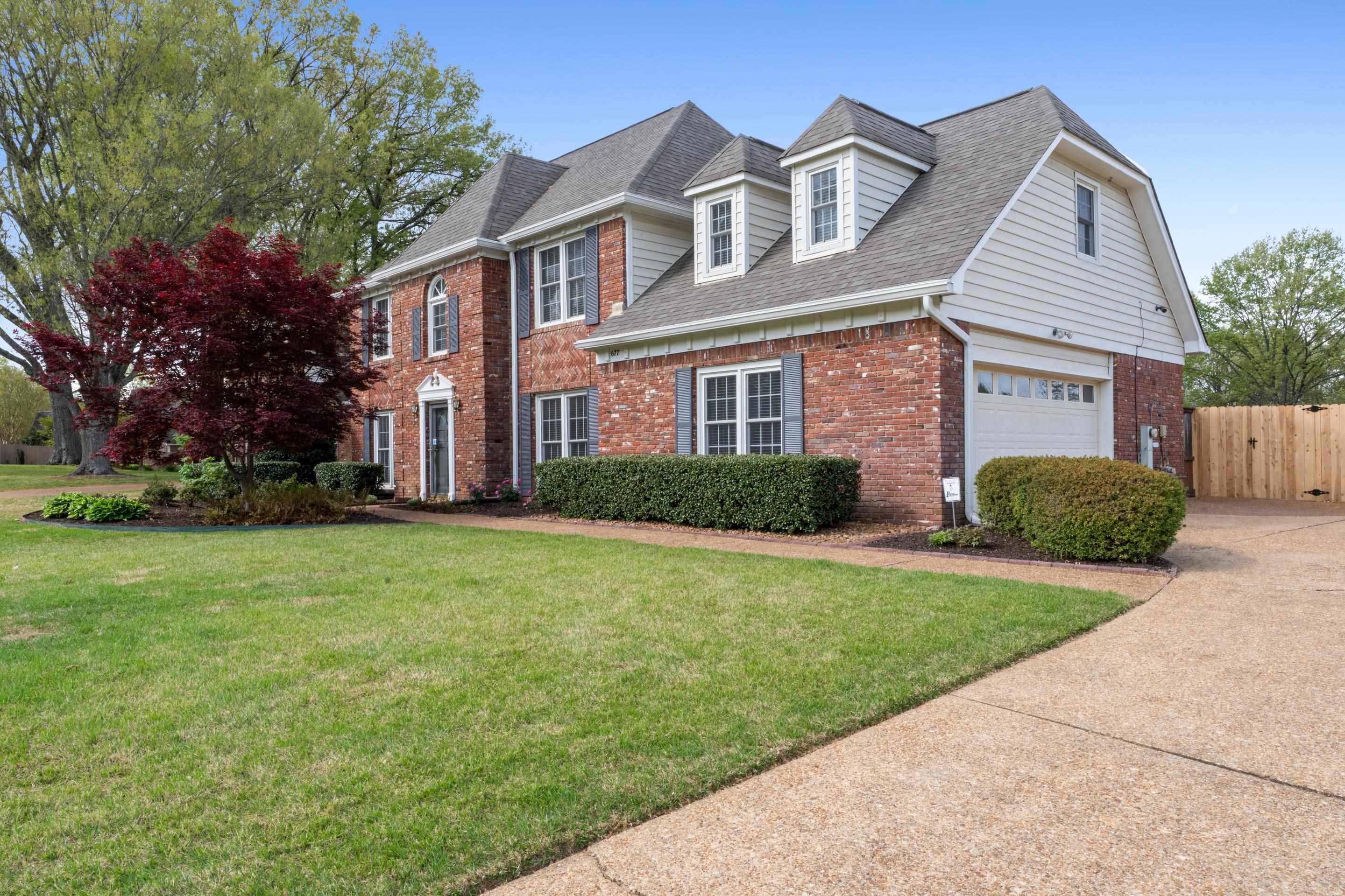 677 Gunnison Cove Collierville, TN 38017 - Photo 26 of 30 front view of a house next to a yard