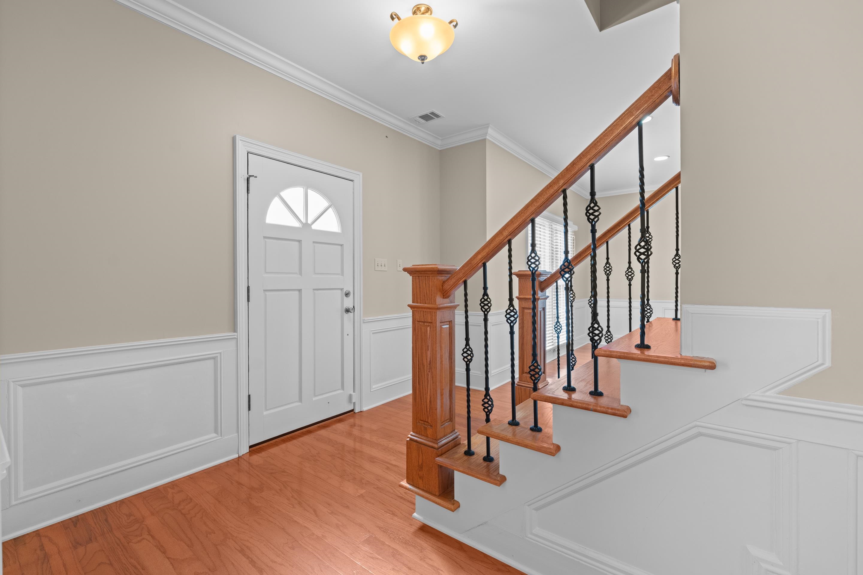 677 Gunnison Cove Collierville, TN 38017 - Photo 3 of 30 a view of entryway with wooden floor and stairs