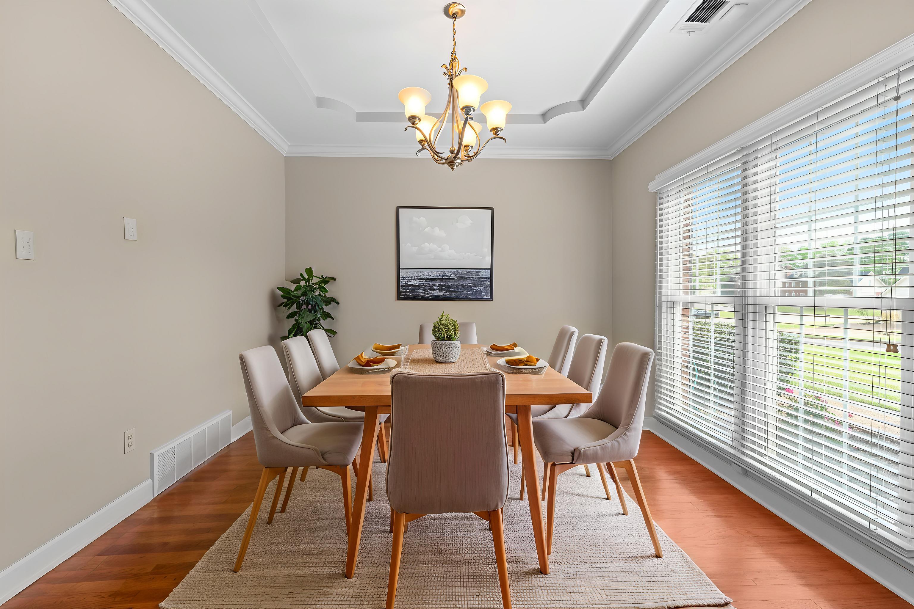 677 Gunnison Cove Collierville, TN 38017 - Photo 4 of 30 a view of a dining room with furniture window and wooden floor
