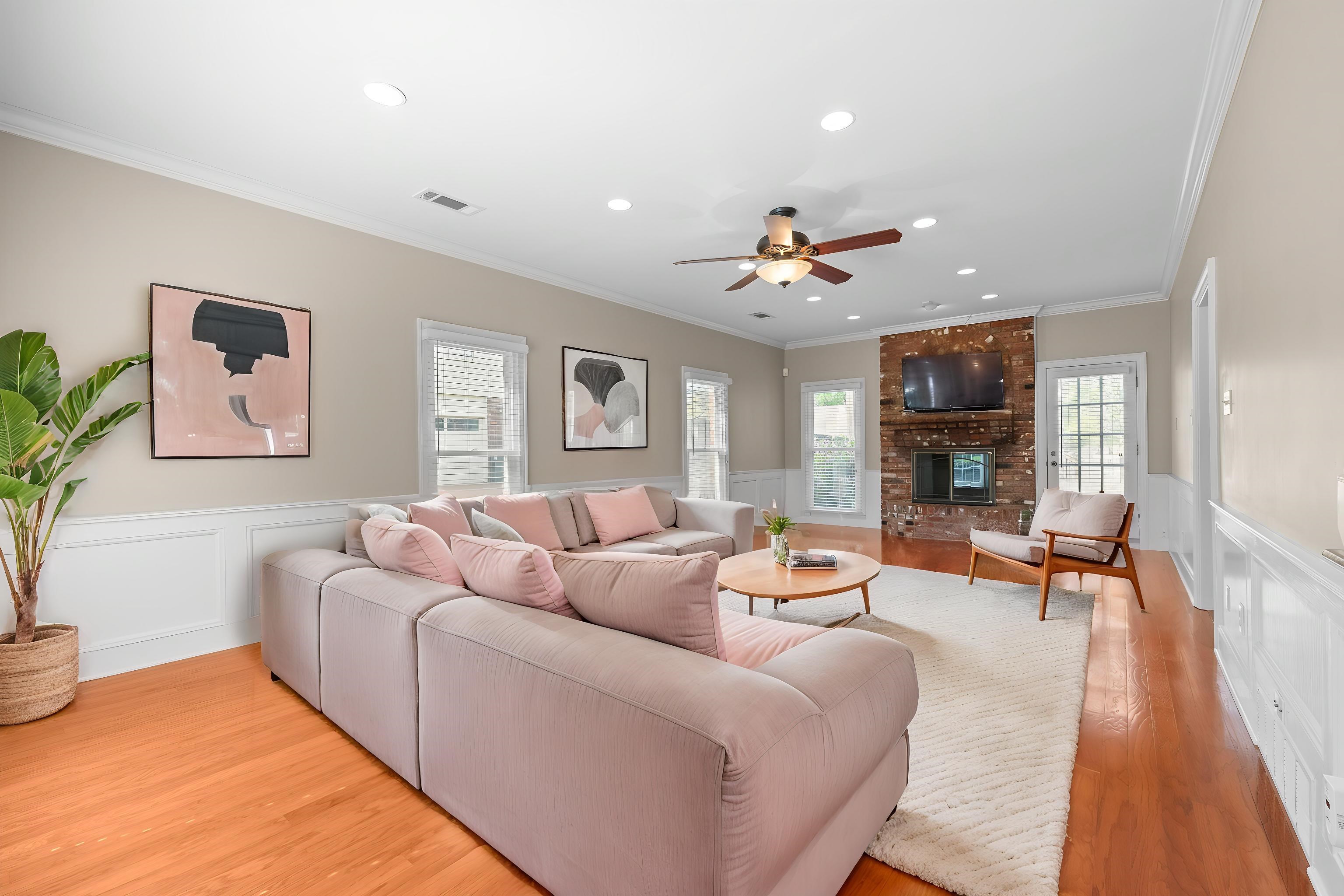 677 Gunnison Cove Collierville, TN 38017 - Photo 10 of 30 a living room with furniture a fireplace and a flat screen tv