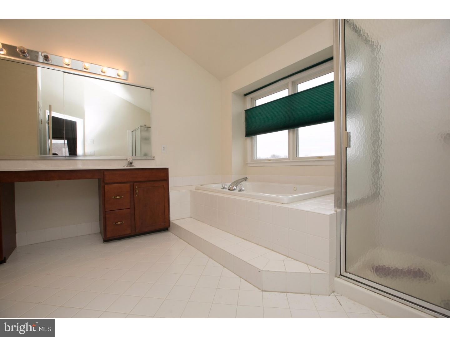 99 Hope Road Southampton, PA 18966 - Photo 14 of 17 a bathroom with a tub sink and mirror