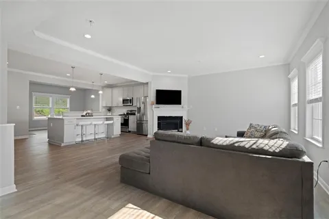 a living room with furniture and flat screen tv