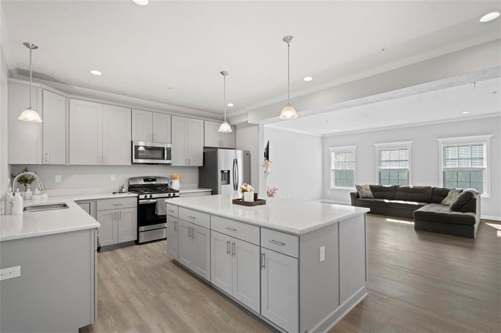 209 Lockheed Drive Coraopolis, PA 15108 - Photo 14 of 38 a kitchen with white cabinets and stainless steel appliances