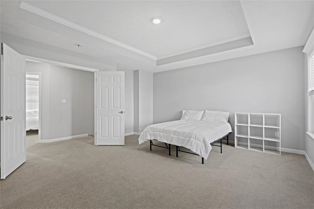 209 Lockheed Drive Coraopolis, PA 15108 - Photo 24 of 38 a spacious bedroom with a bed and a window