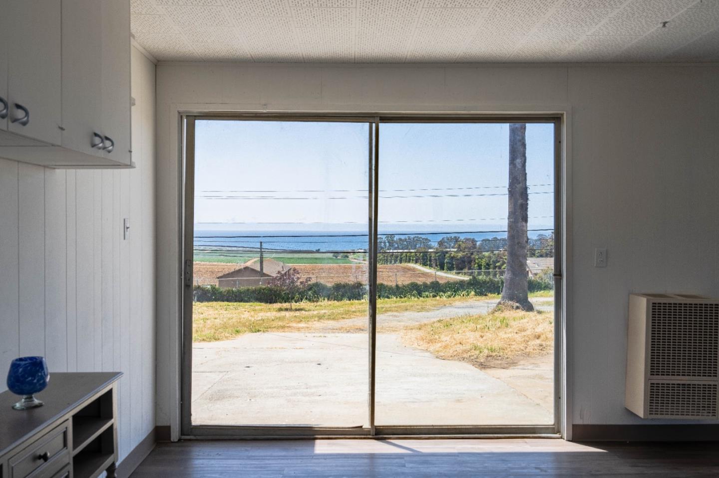 706 San Andreas Road Watsonville, CA 95076 - Photo 13 of 26 a view of an empty room and wooden floor and a window