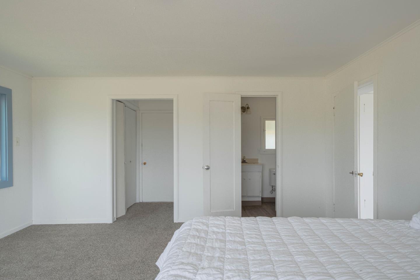 706 San Andreas Road Watsonville, CA 95076 - Photo 15 of 26 a bedroom with a bed and closet