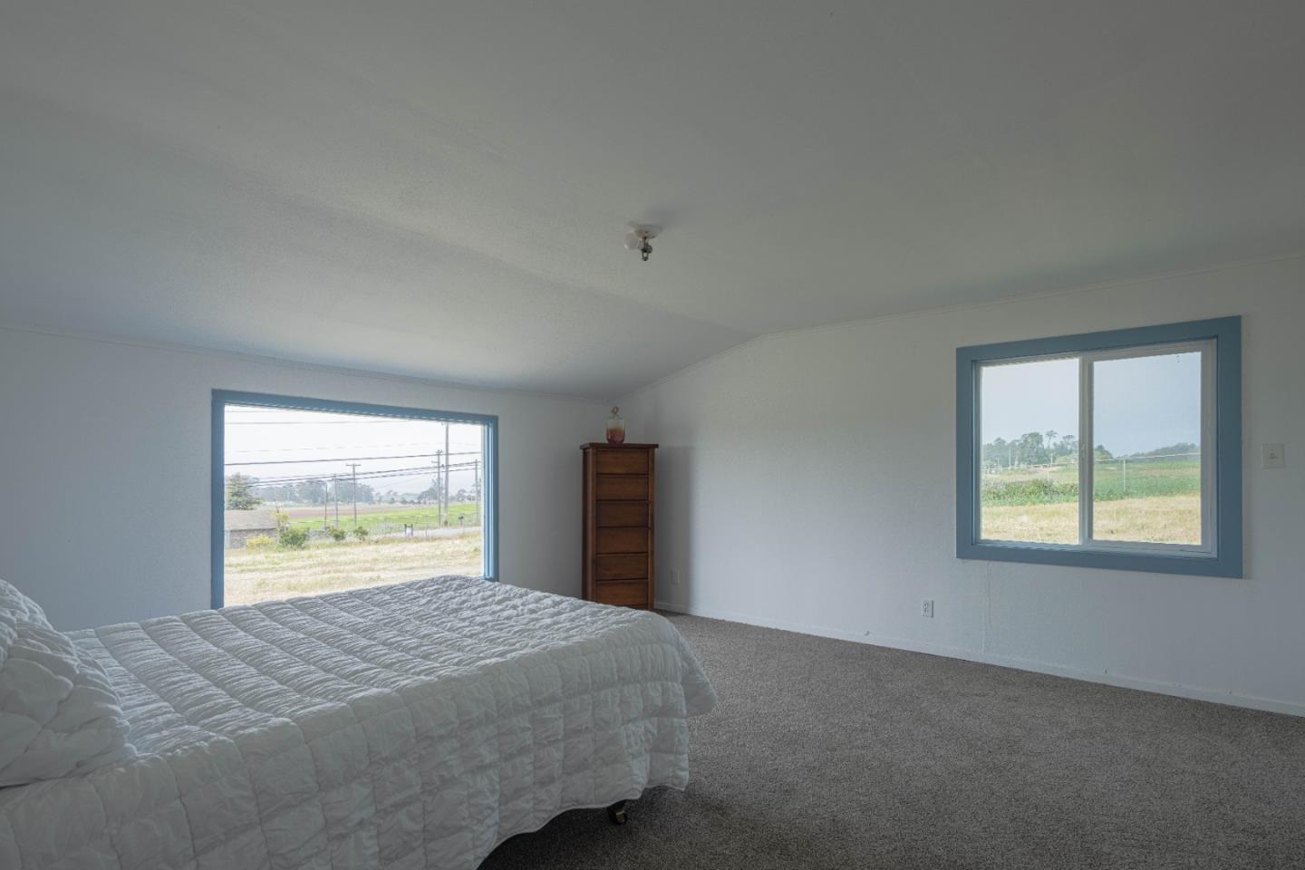 706 San Andreas Road Watsonville, CA 95076 - Photo 16 of 26 a bedroom with a bed and a window