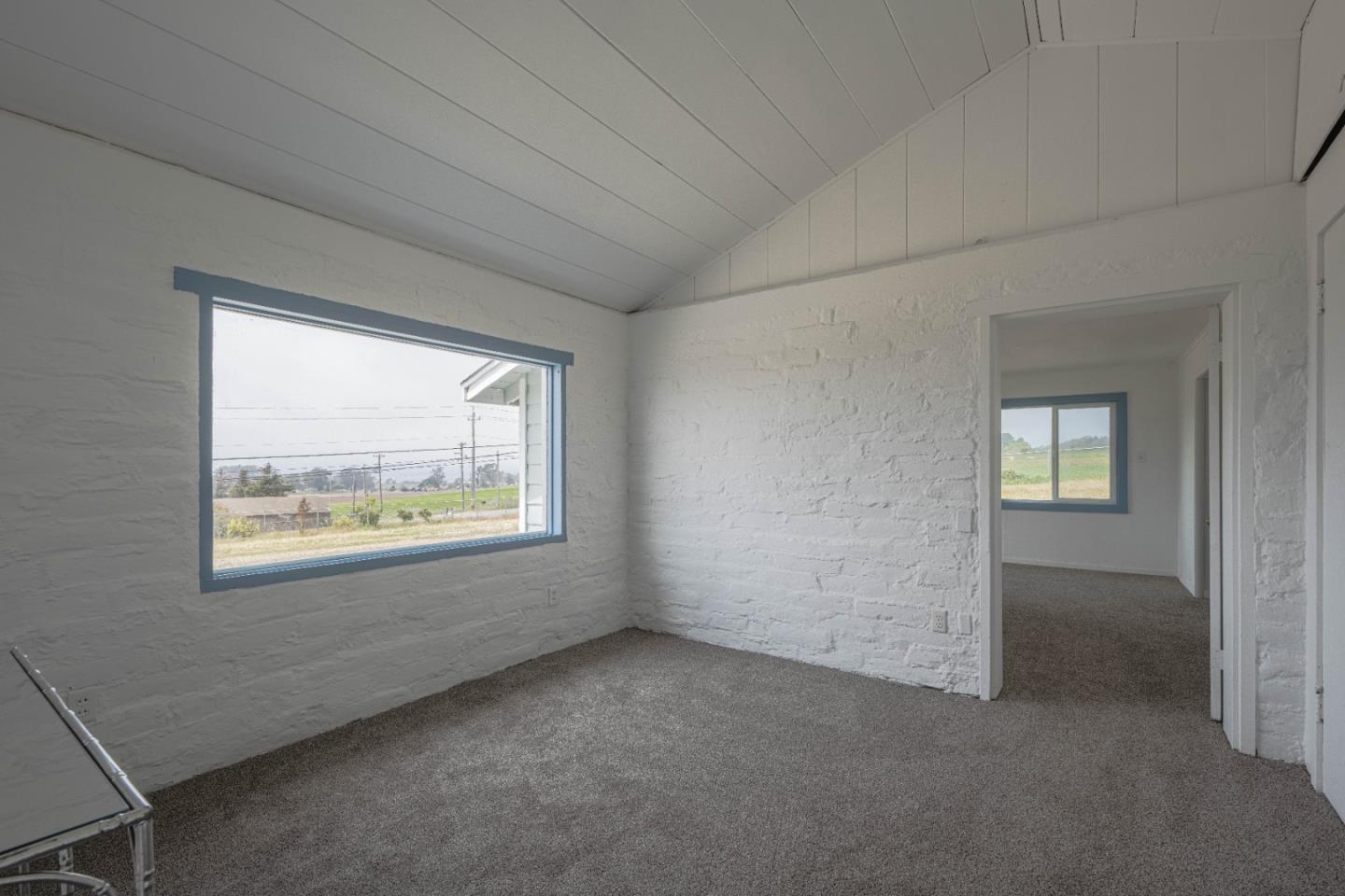 706 San Andreas Road Watsonville, CA 95076 - Photo 17 of 26 a view of an empty room with a window