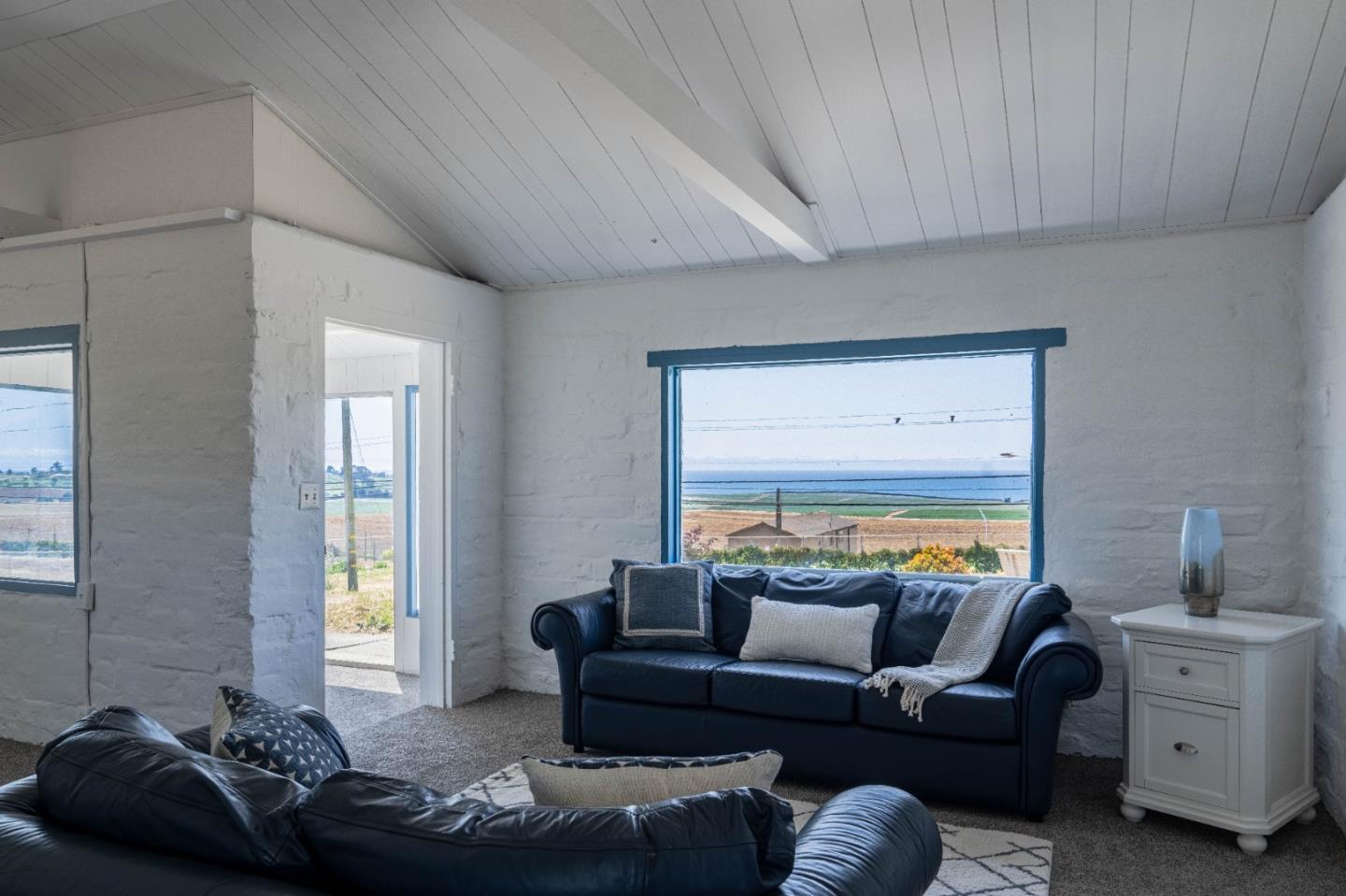 706 San Andreas Road Watsonville, CA 95076 - Photo 3 of 26 a living room with furniture and a window