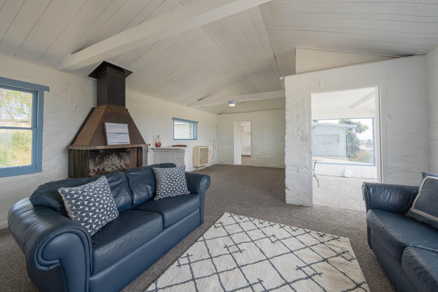 706 San Andreas Road Watsonville, CA 95076 - Photo 4 of 26 a living room with furniture and a window