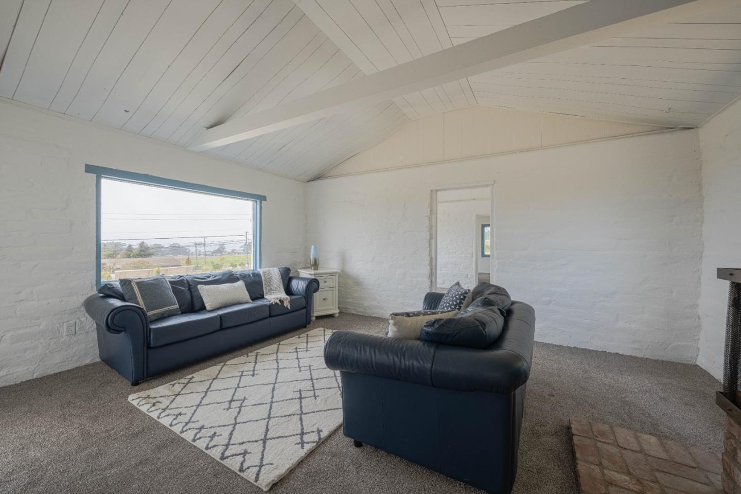 706 San Andreas Road Watsonville, CA 95076 - Photo 8 of 26 a living room with furniture and a window