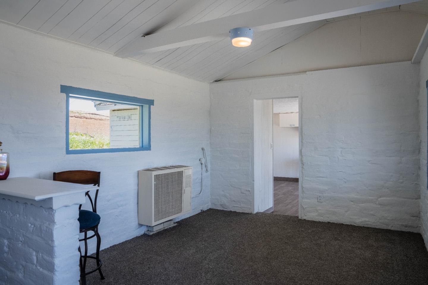 706 San Andreas Road Watsonville, CA 95076 - Photo 9 of 26 a view of an empty room with a window