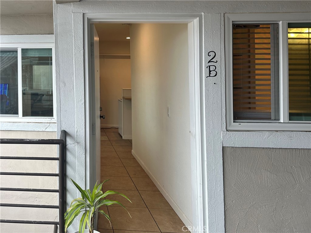 641 Ramona Avenue, Unit 2B Laguna Beach, CA 92651 - Photo 2 of 5 a view of a hallway with a window