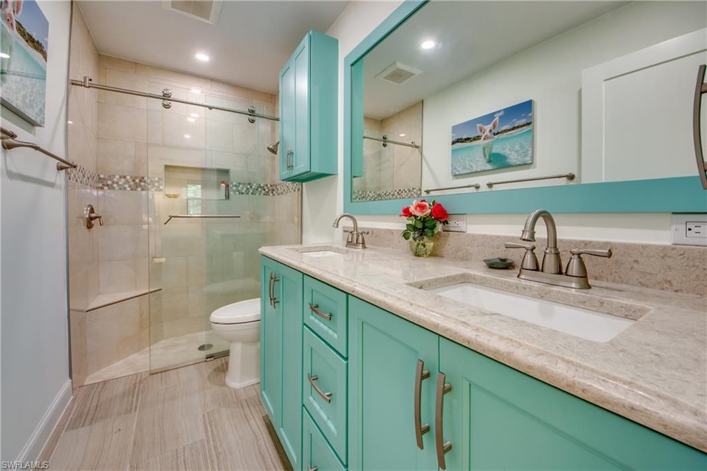 16541 Bayleaf Lane, Unit 56 Fort Myers, FL 33908 - Photo 11 of 24 a bathroom with a sink a toilet and shower