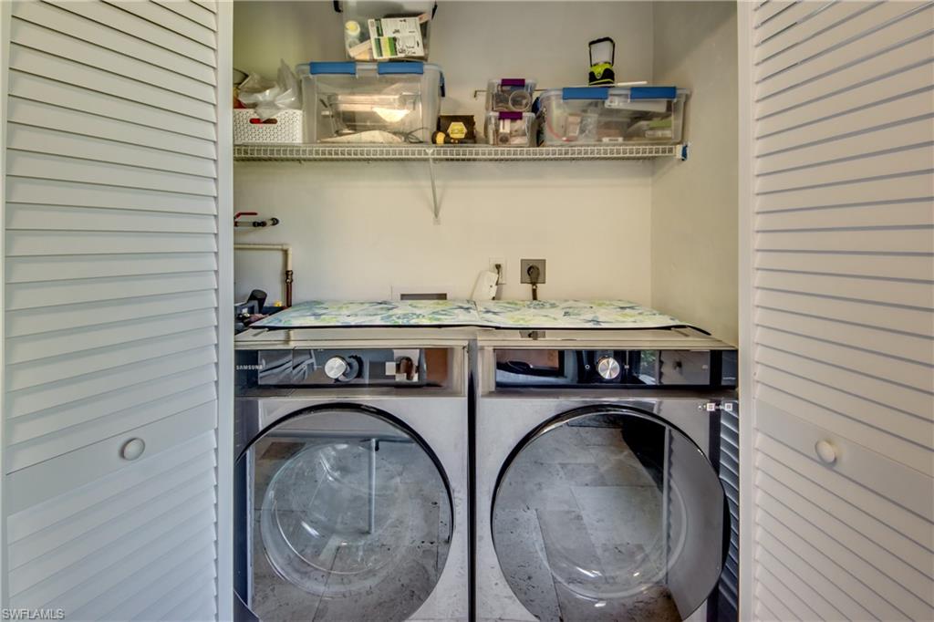 16541 Bayleaf Lane, Unit 56 Fort Myers, FL 33908 - Photo 14 of 24 a utility room with sink dryer and washer
