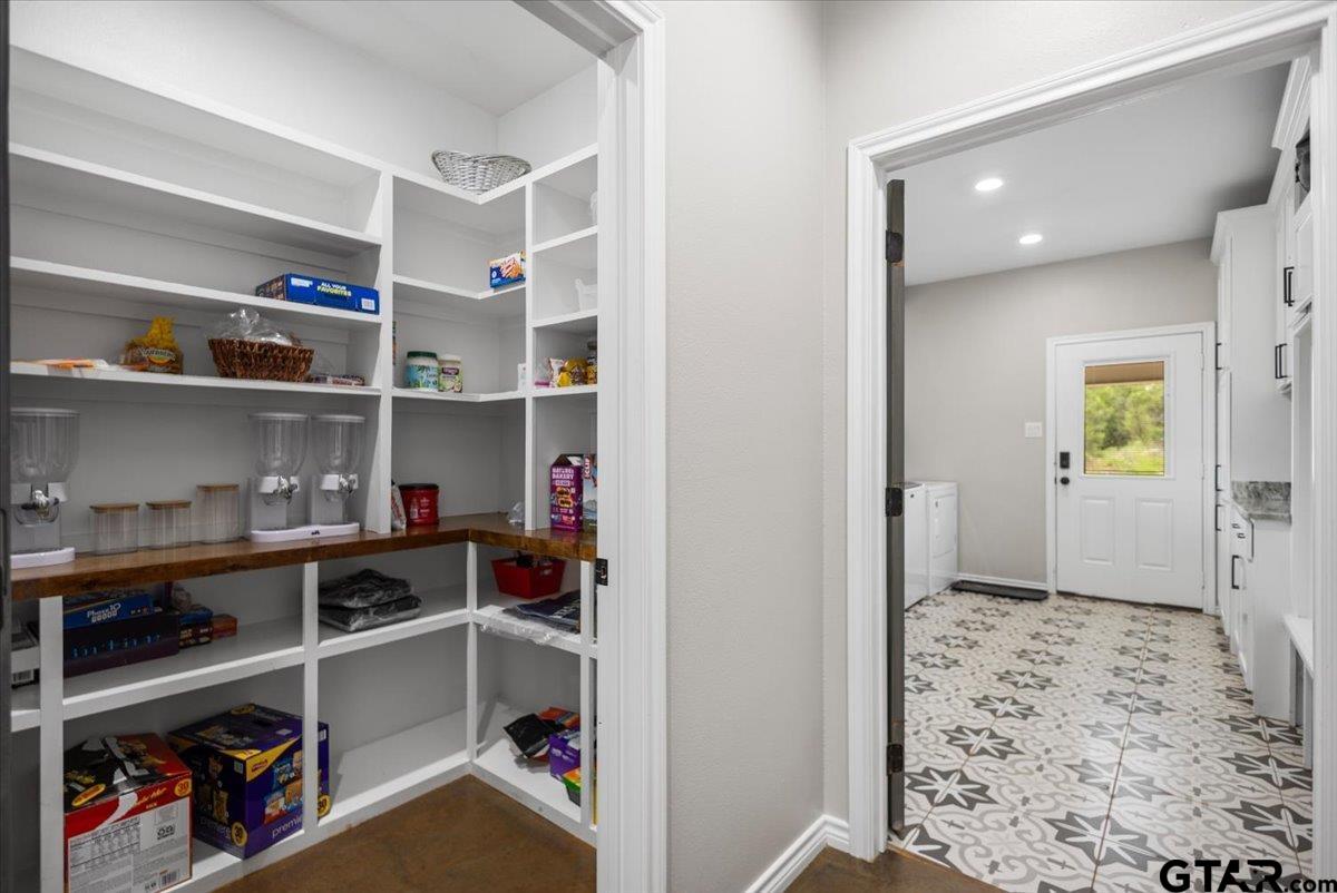 9235 Farm To Market Road 851 Rusk, TX 75785 - Photo 16 of 47 a view of walk in closet with clothes and shoes