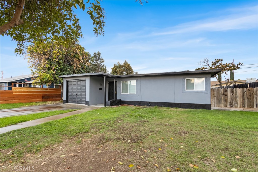 1675 Rose Avenue Merced, CA 95341 - Photo 16 of 17 a backyard of a house with yard and outdoor seating