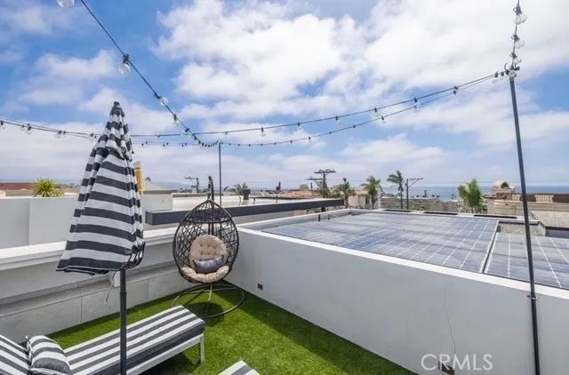 a view of a swimming pool with a roof deck