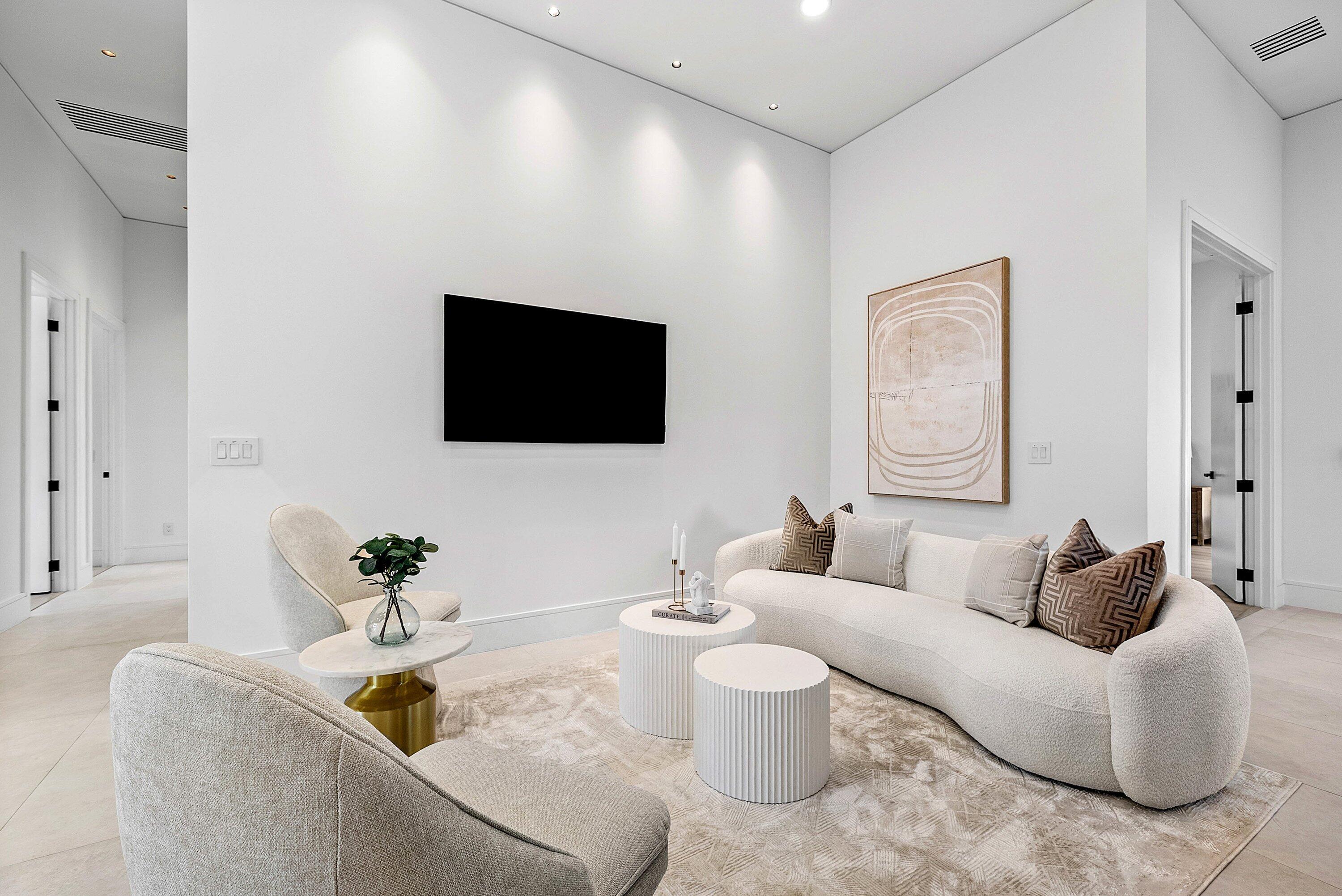 3361 Northeast 4th Avenue Boca Raton, FL 33431 - Photo 11 of 44 a living room with furniture and a flat screen tv