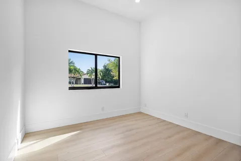 a bathroom with a white bath tub and a shower