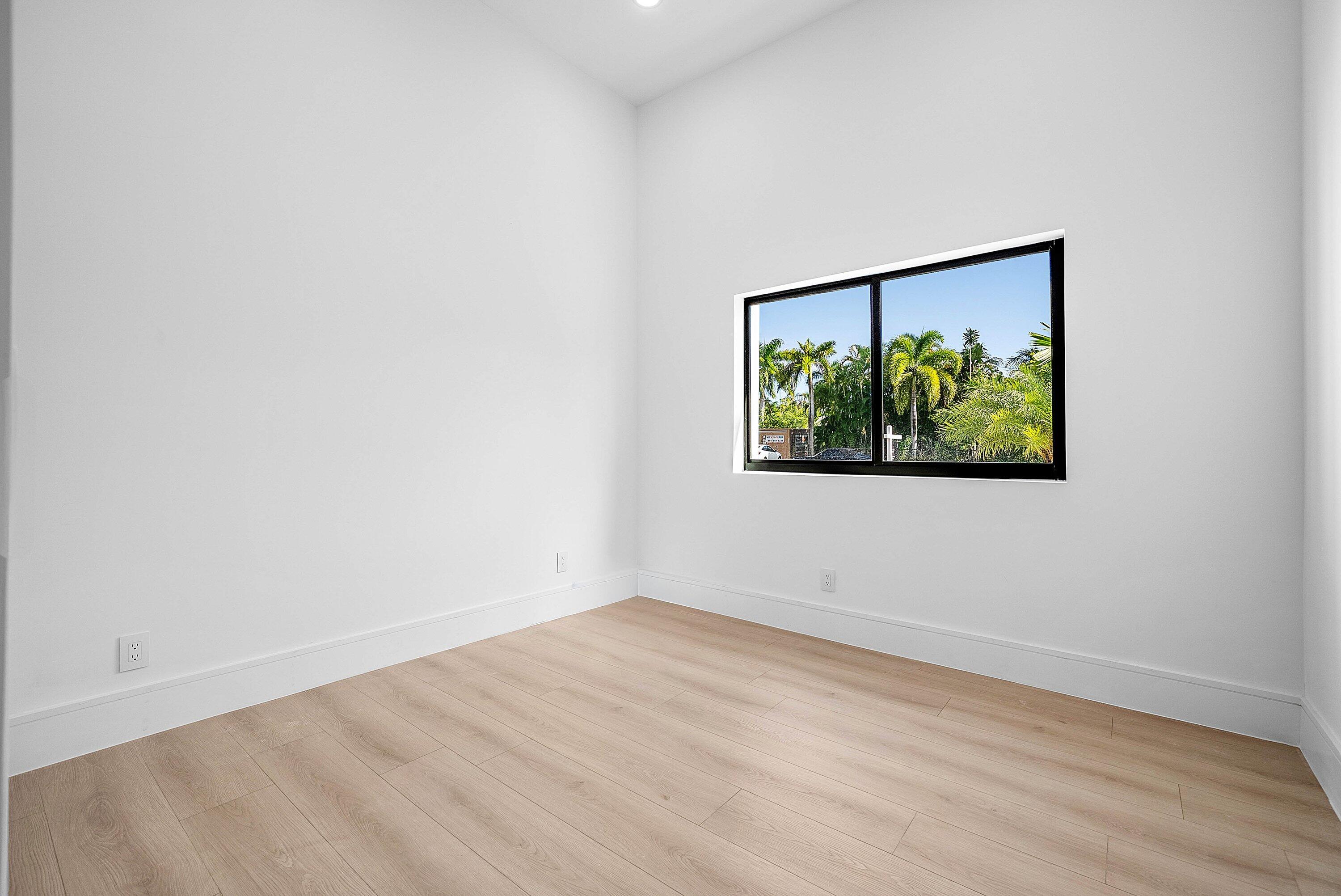 3361 Northeast 4th Avenue Boca Raton, FL 33431 - Photo 25 of 44 a view of empty room with wooden floor