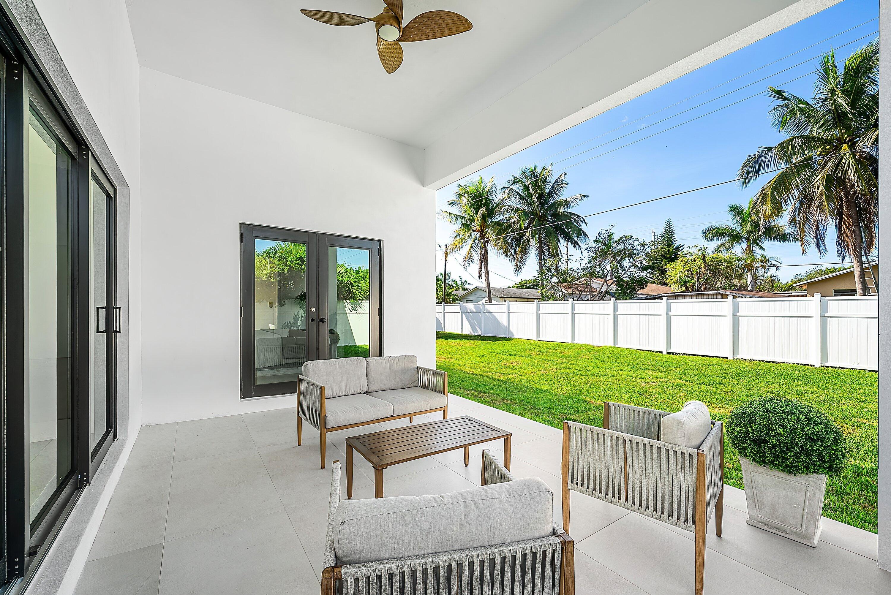3361 Northeast 4th Avenue Boca Raton, FL 33431 - Photo 27 of 44 a view of a porch with furniture and garden