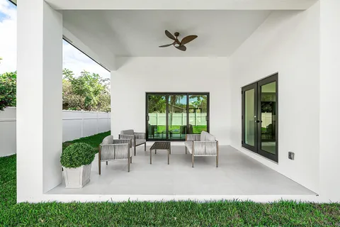 a view of two chairs in a patio