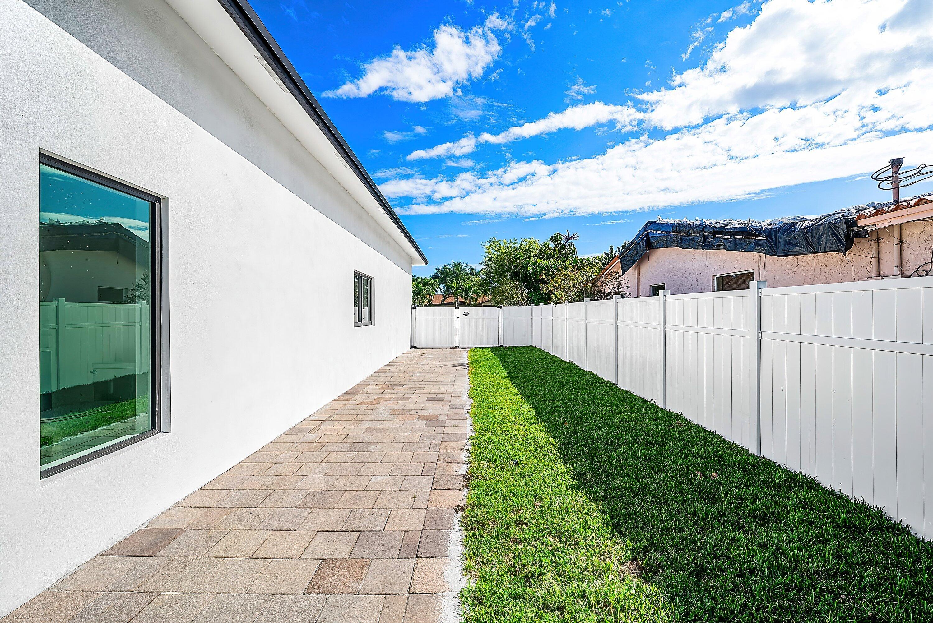 3361 Northeast 4th Avenue Boca Raton, FL 33431 - Photo 29 of 44 a view of a backyard with pathway