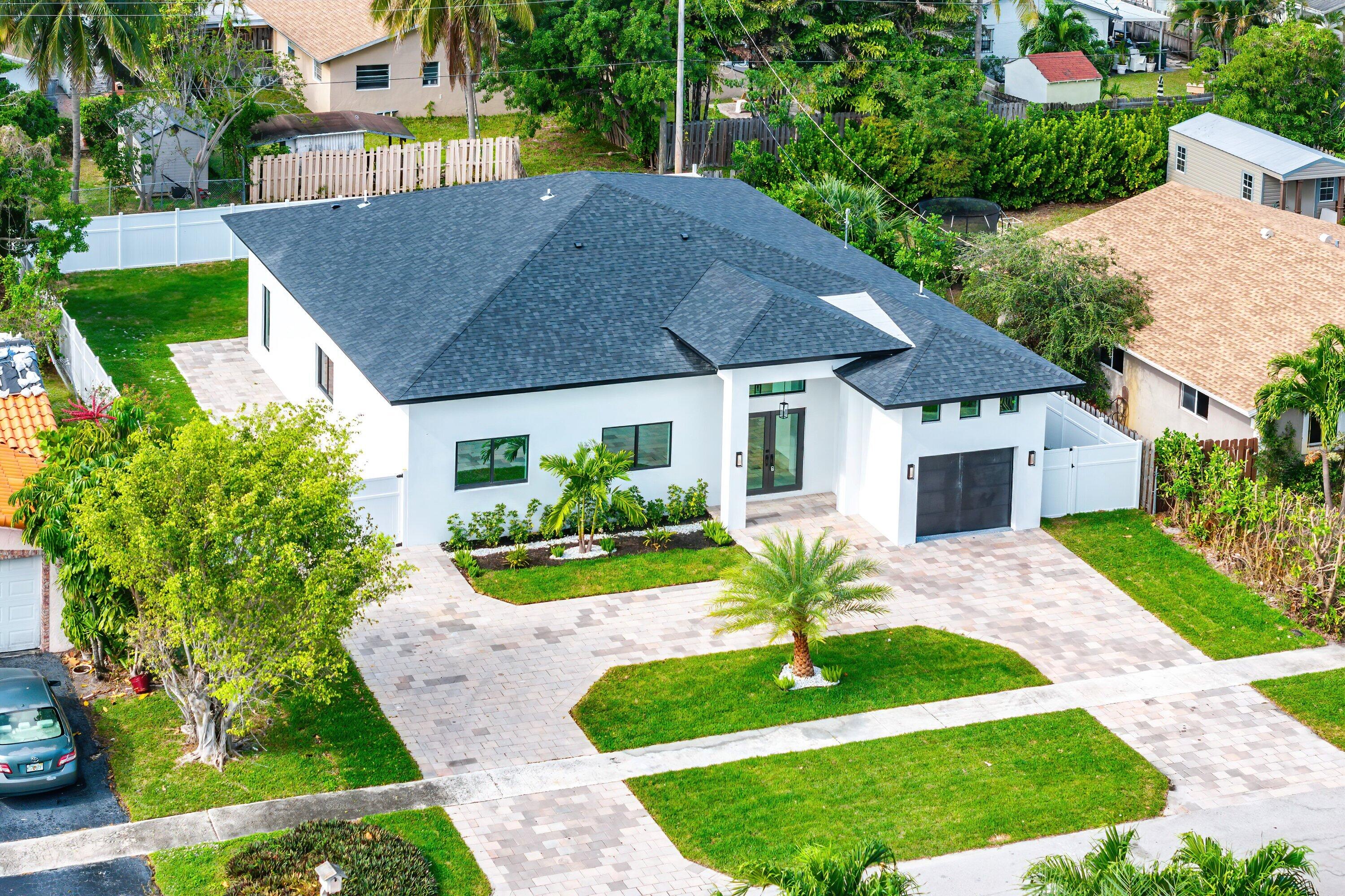 3361 Northeast 4th Avenue Boca Raton, FL 33431 - Photo 31 of 44 a view of a house with a yard and potted plants