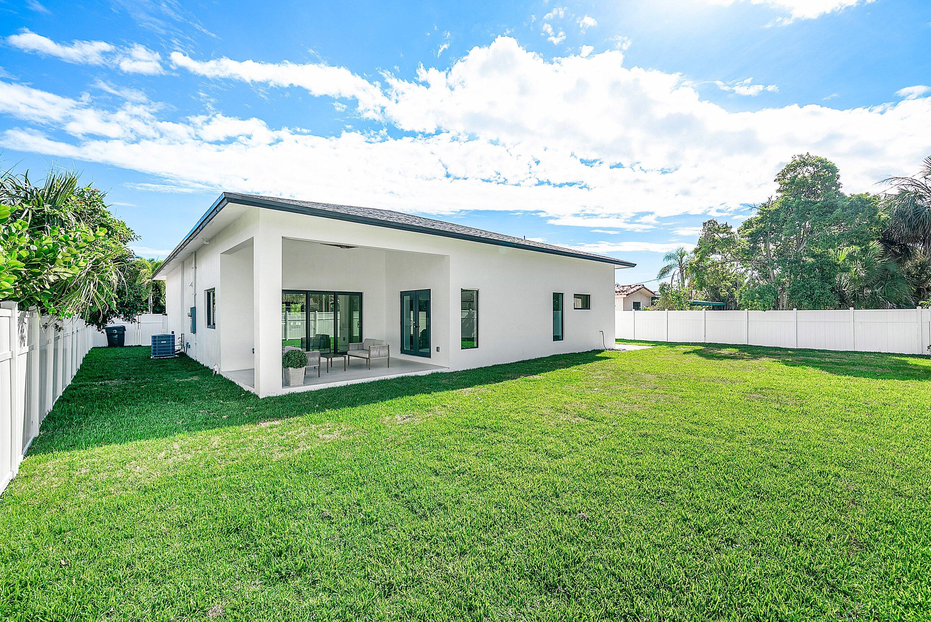3361 Northeast 4th Avenue Boca Raton, FL 33431 - Photo 4 of 44 a view of a backyard with plants and a garden