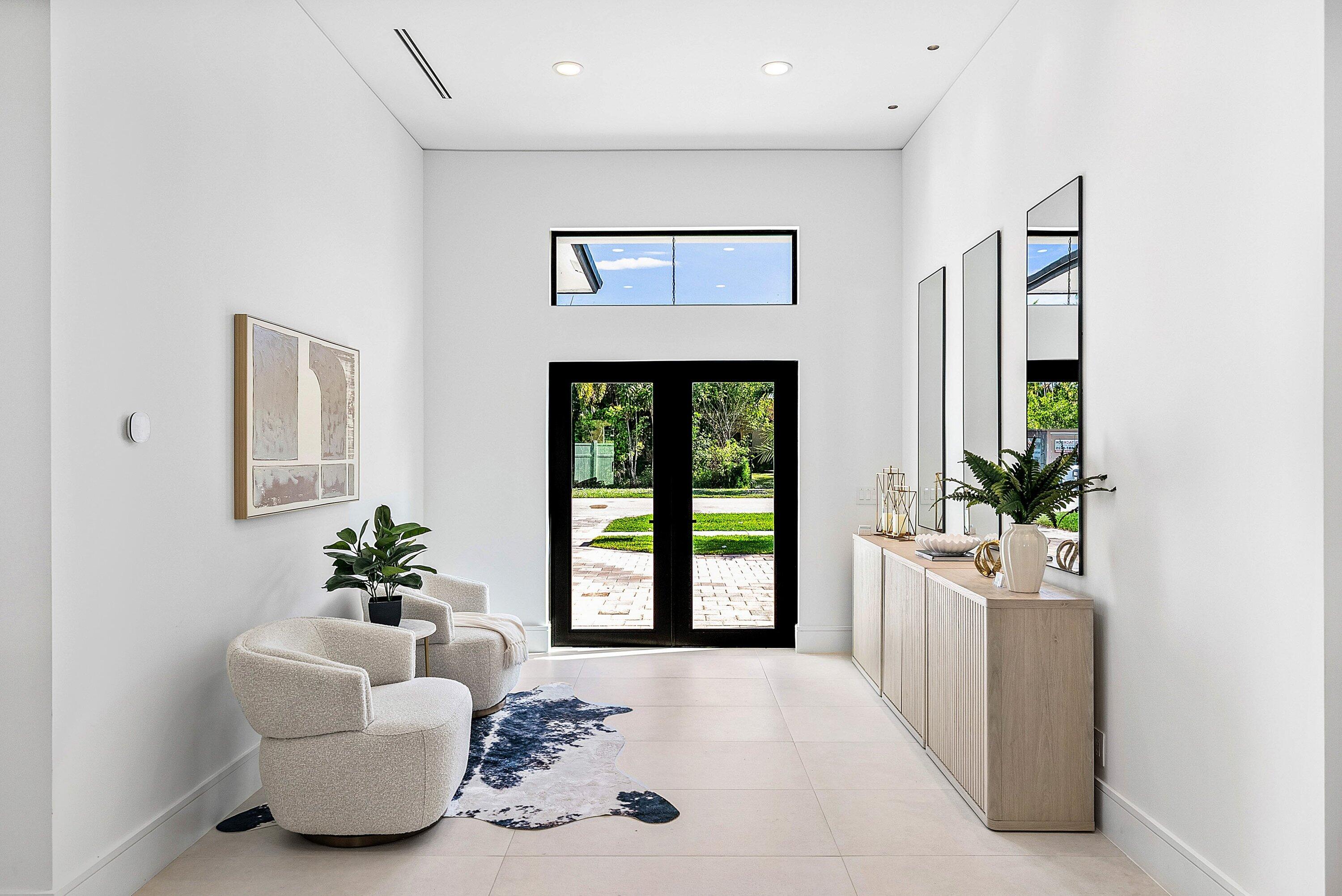 3361 Northeast 4th Avenue Boca Raton, FL 33431 - Photo 7 of 44 a living room with furniture and a potted plant