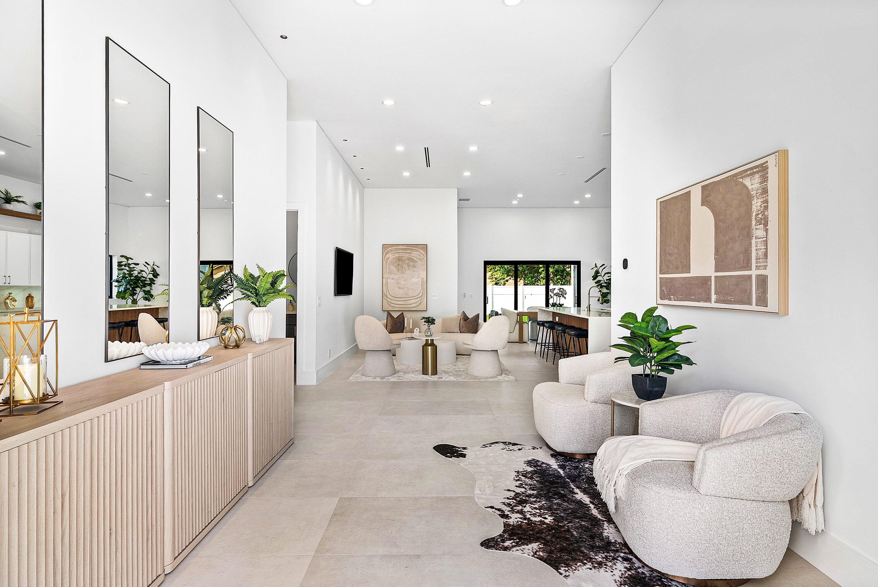 3361 Northeast 4th Avenue Boca Raton, FL 33431 - Photo 8 of 44 a living room with furniture potted plant wooden floor and a large window