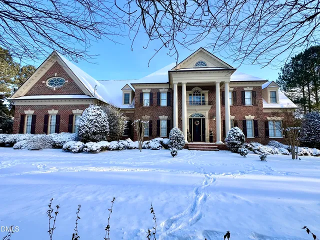 an aerial view of residential house with outdoor space and swimming pool