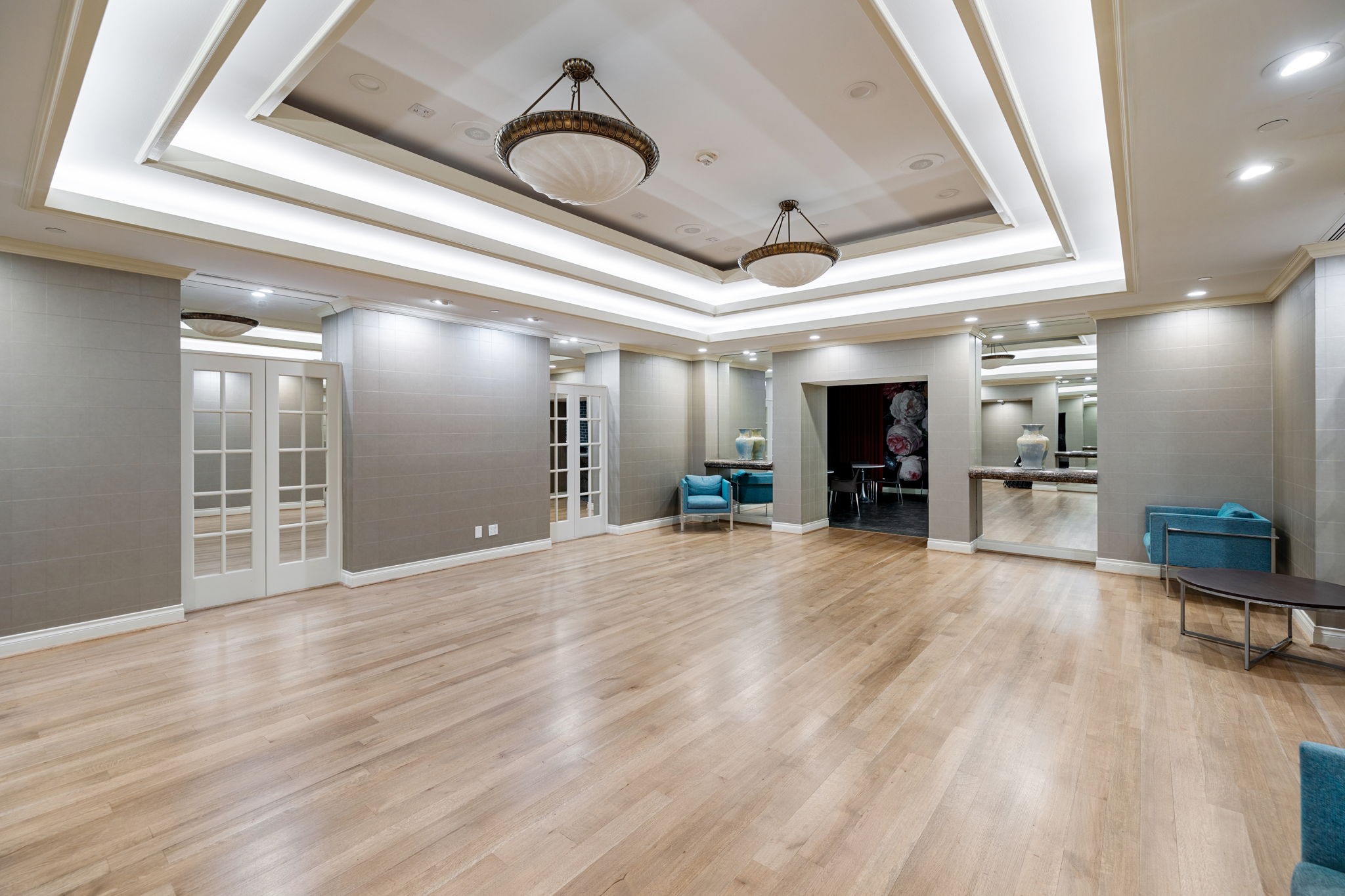 2001 Holcombe Boulevard, Unit 1801 Houston, TX 77030 - Photo 29 of 31 a view of a hallway with wooden floor and a kitchen