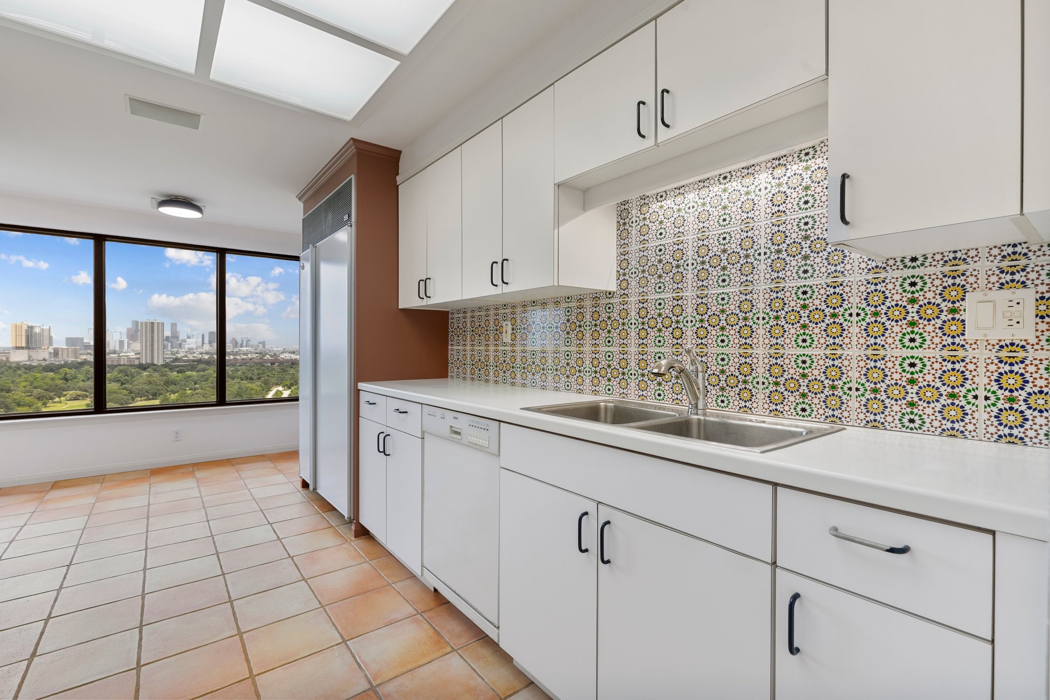 2001 Holcombe Boulevard, Unit 1801 Houston, TX 77030 - Photo 8 of 31 a kitchen with a sink a counter top space and cabinets