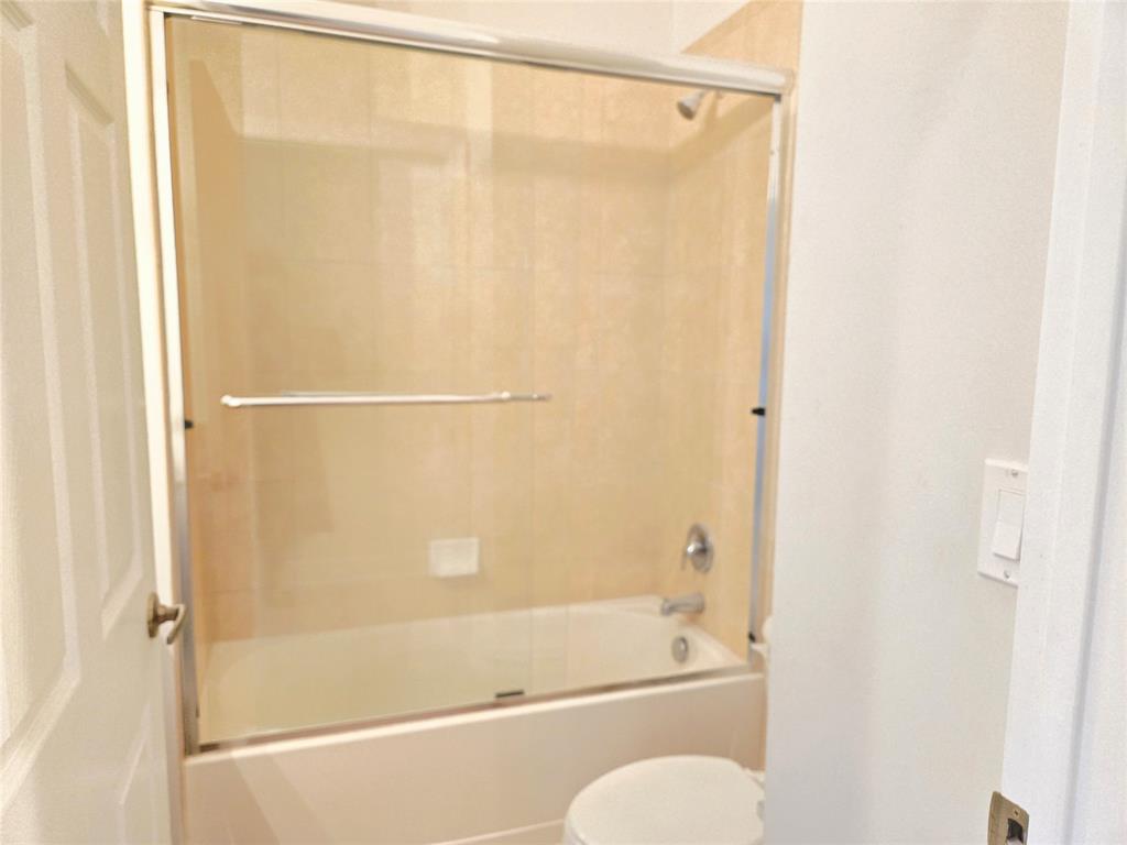 1528 Southwest 147th Avenue, Unit 1527 Pembroke Pines, FL 33027 - Photo 12 of 18 a bathroom with a shower and a bath tub