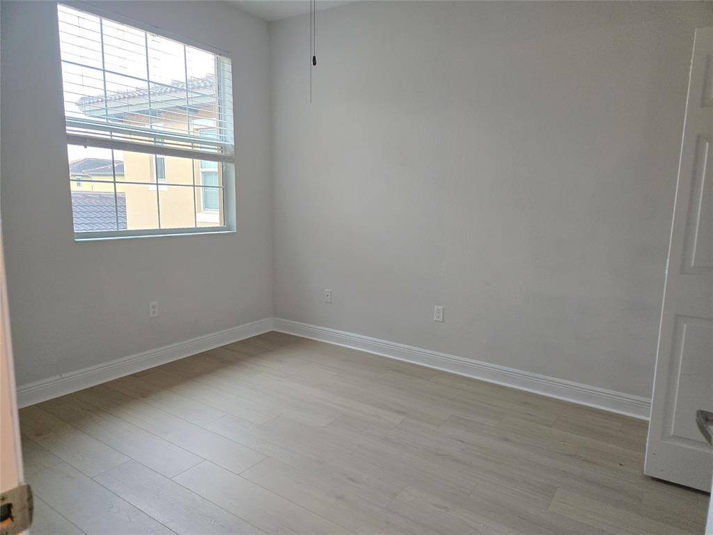 1528 Southwest 147th Avenue, Unit 1527 Pembroke Pines, FL 33027 - Photo 13 of 18 an empty room with a window