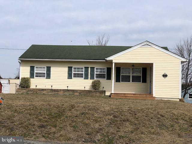 The little yellow house on the hill.